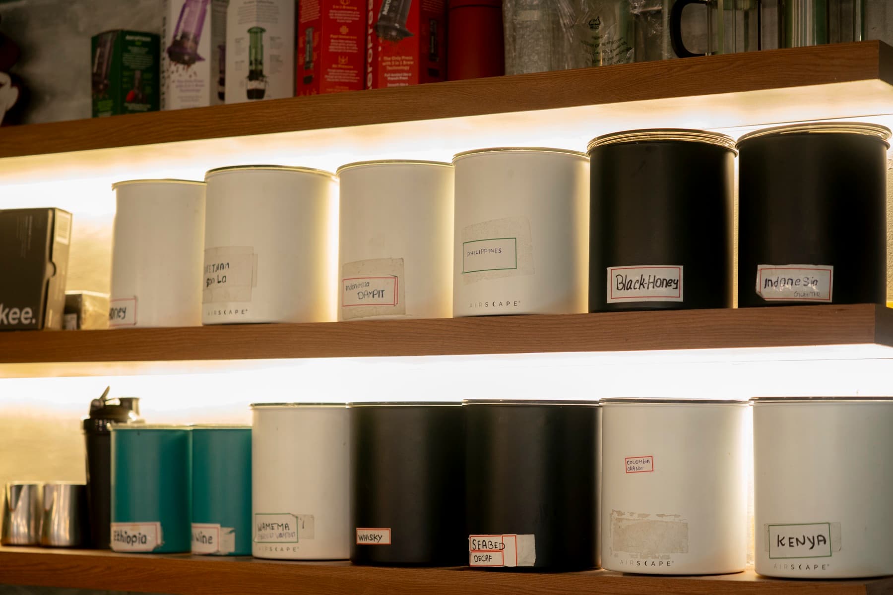 The origin canister wall behind the bar